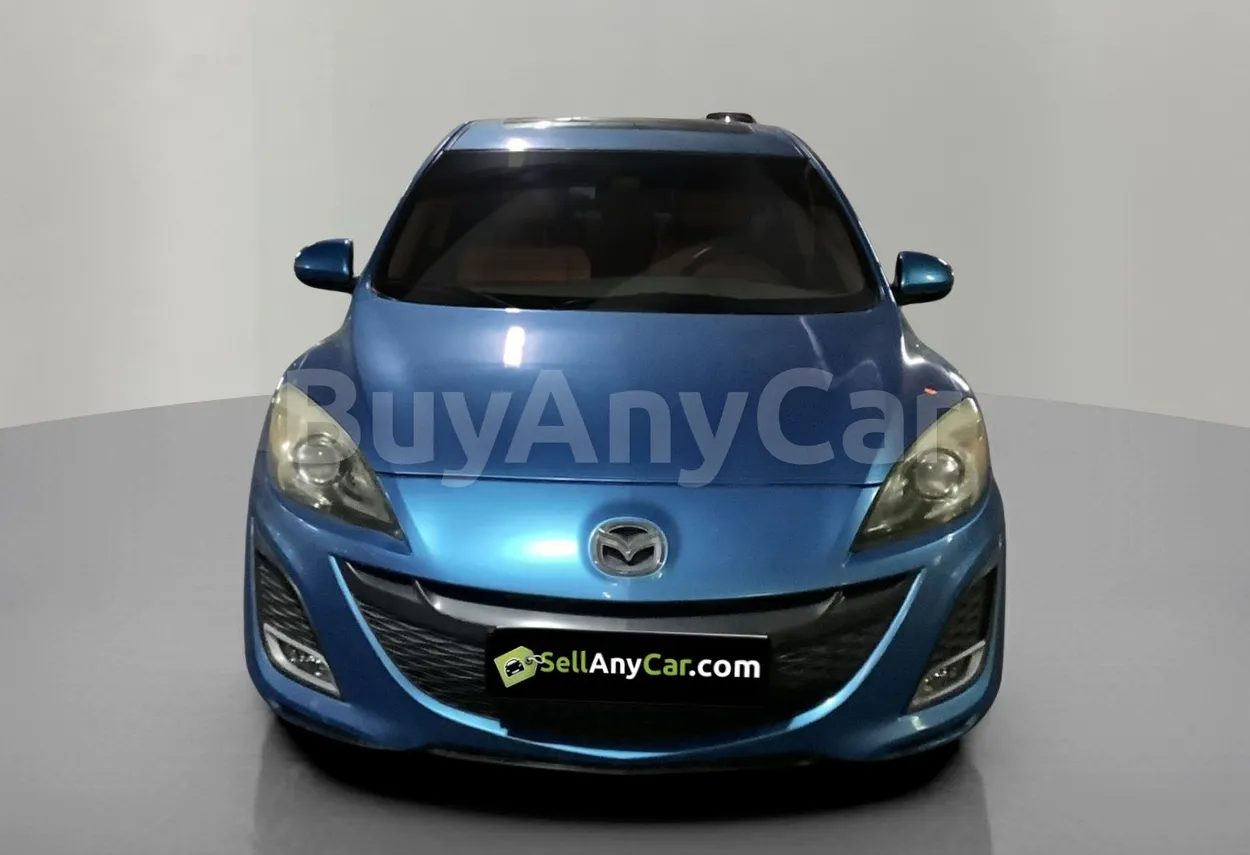 Mazda 3 2010 — photo 1